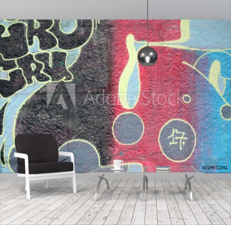 Image de Fragment of graffiti drawings The old wall decorated with paint stains in the style of street art culture Multicolored background texture